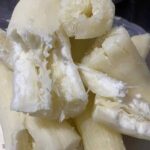 What does this gesture with the thumb tucked between the fingers mean?